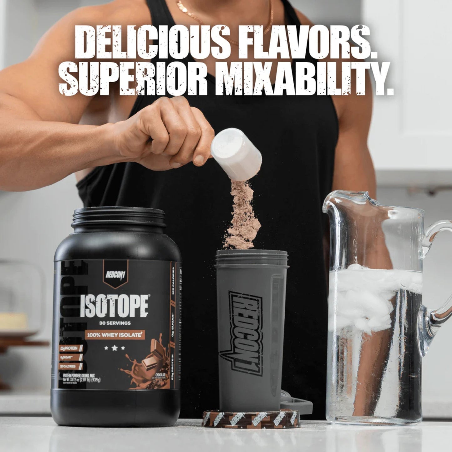 Person pouring supplement powder into a shaker with 'Isotope' branding.