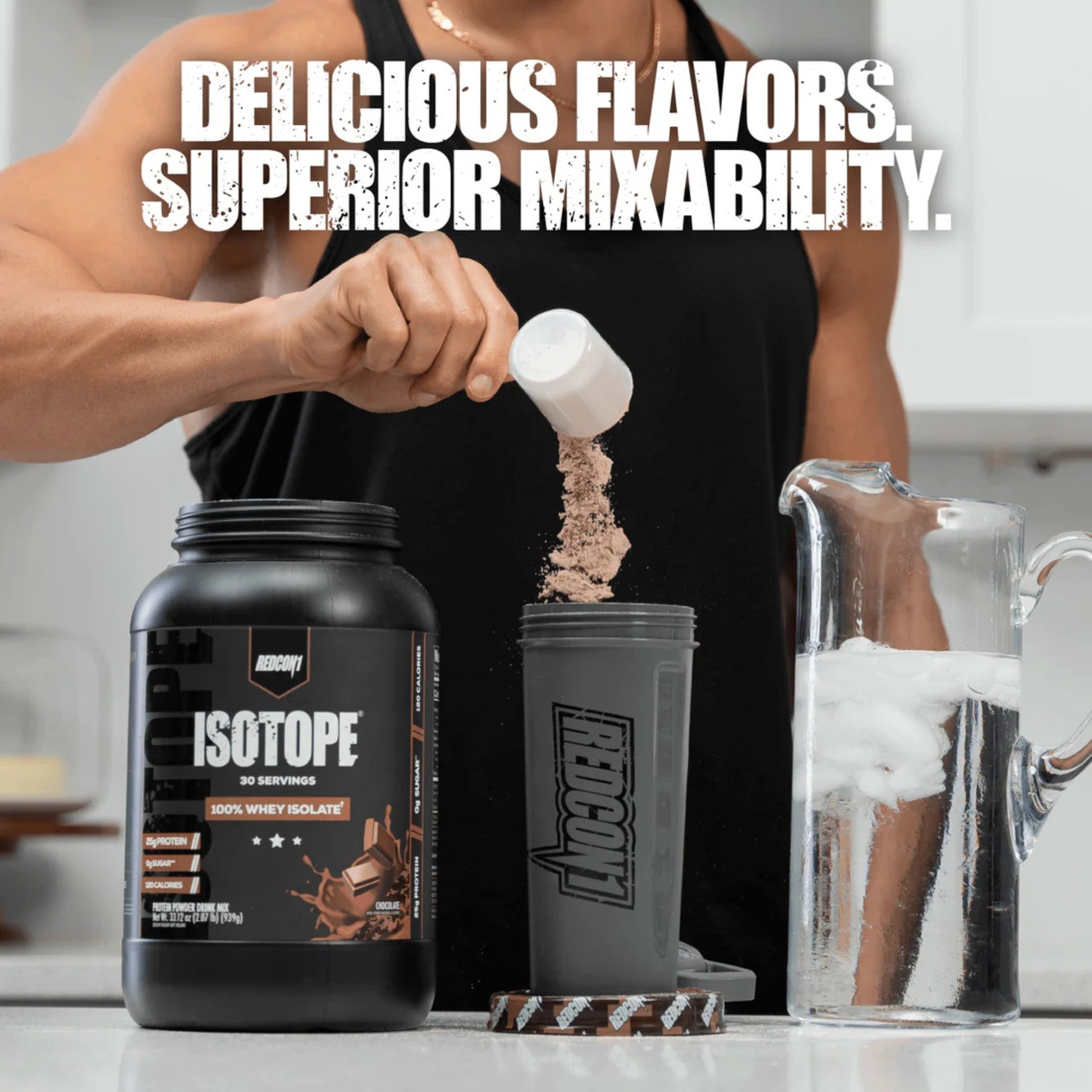 Person pouring supplement powder into a shaker with 'Isotope' branding.