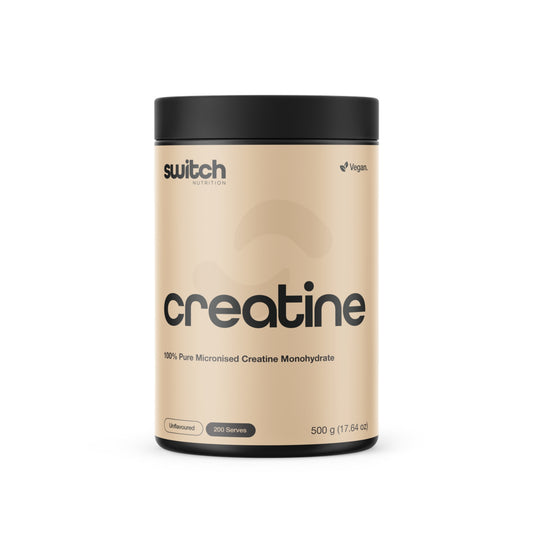 Beige container of Switch Nutrition creatine powder on a white background